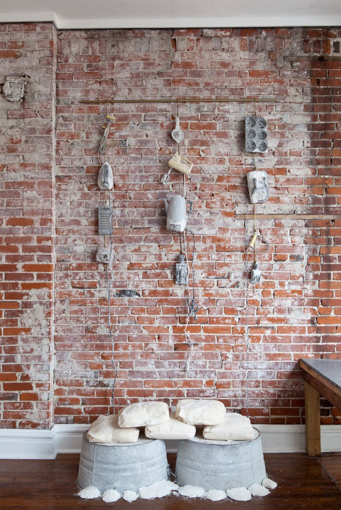Cleavemark Dr., sugar-coated installation: sugared basins w/ cast sugar bags + sugar-coated kitchenware + “sugar prints” (on floor): “THERE IS A CONTAINER ABOUT THE SIZE OF ME.” Stephanie Ellis Schlaifer & Cheryl Wassenaar, Fort Gondo Compound for the Arts, fall 2014